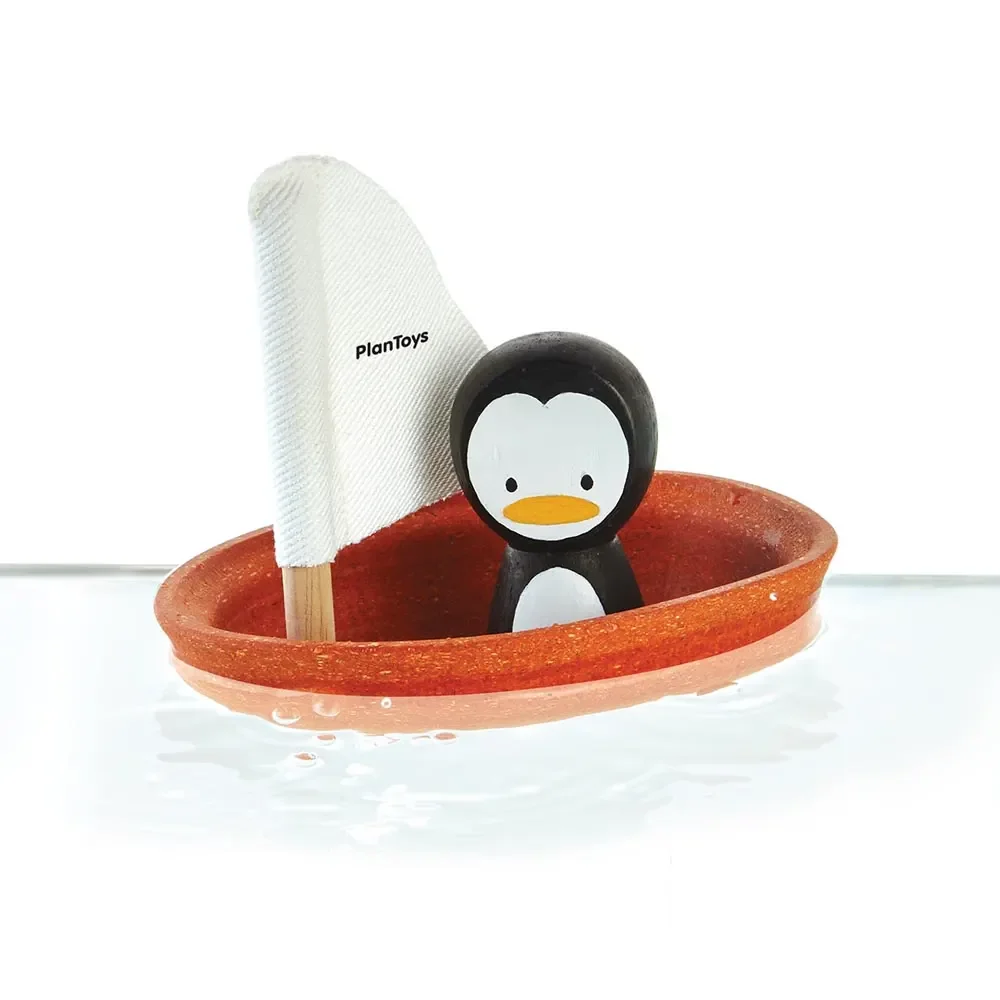 "Plan Toys Bateau de bain orange pingouin image"