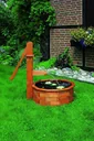 Wooden trough round as a water feature solar