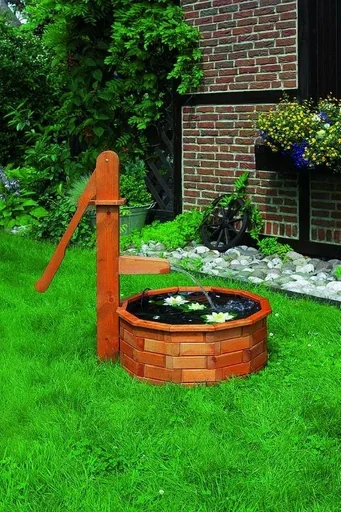 "Wooden trough round as a water feature solar image"